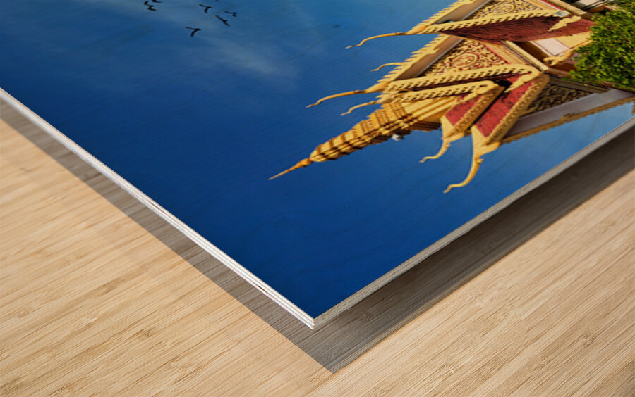 Golden temple green trees and birds under a blue sky. Wood print