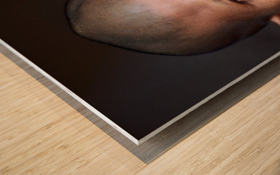 Young Buddhist monk in orange robe close up portrait. Wood print