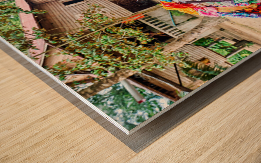 Monk with colorful textiles on a motorcycle. Wood print
