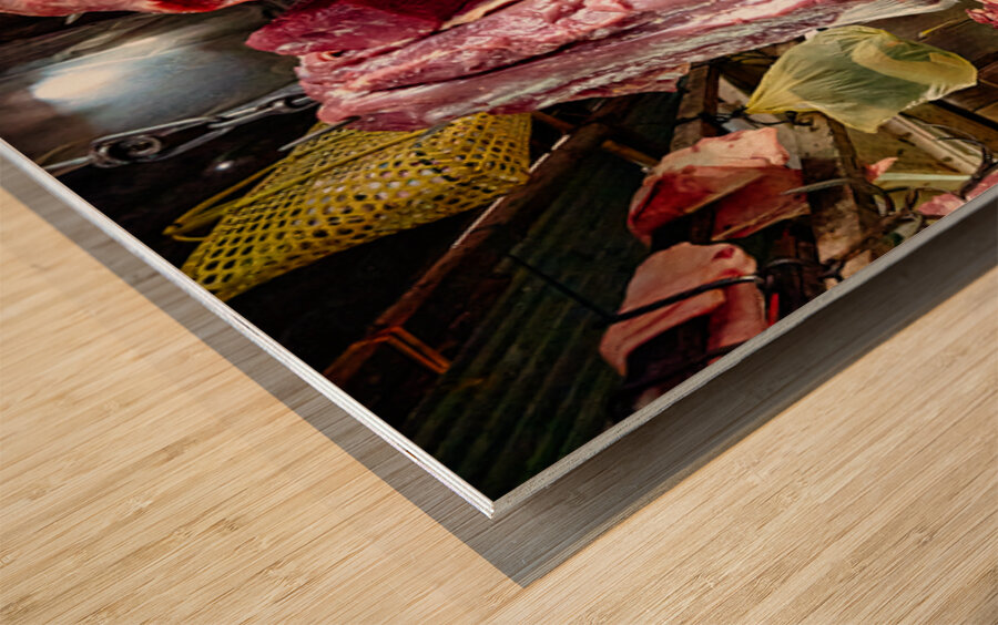 Woman selling raw meat in a bustling market. Wood print