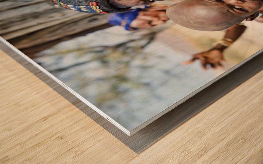 Portrait of young Zemba woman holding child in Kunene Region Wood print