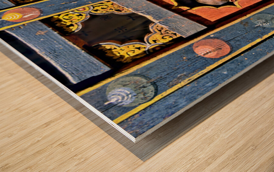 Young monks peeking from decorative colorful windows. Wood print