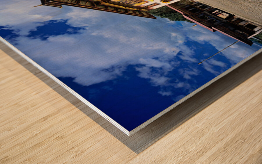 Traditional Bhutanese building with stone courtyard under a clou Wood print
