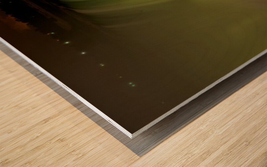 Niagara Falls illuminated with vibrant colors at night. Wood print