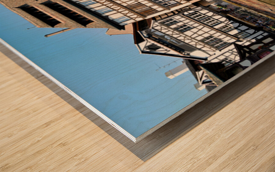 Colored timber houses by the water in Petit France district Wood print