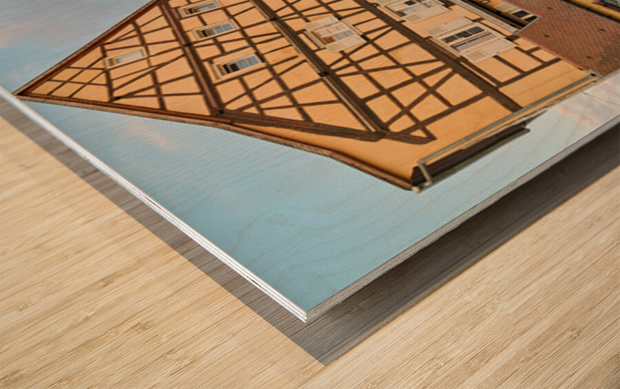 Dining by the canal in Colmar with timber framed houses in view Wood print