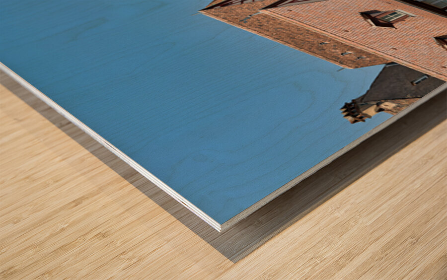 Visitors walk through Colmar on sunny day near timber framed hou Wood print