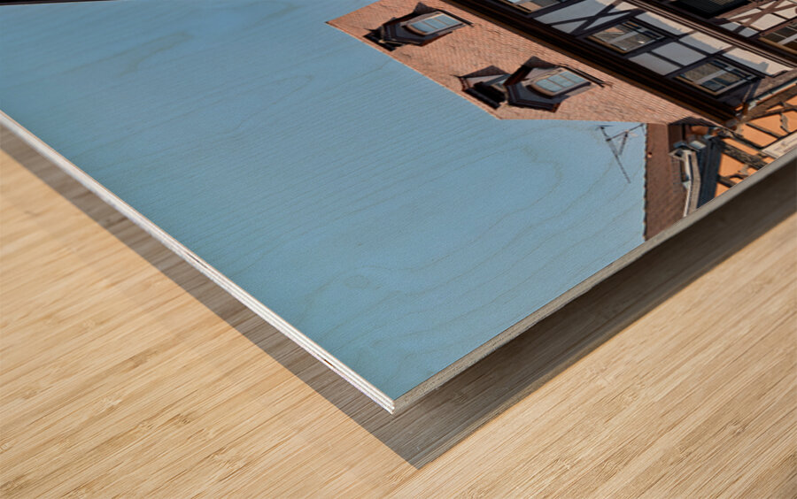 Visitors explore timber framed houses in Colmar Alsace on a sun Wood print