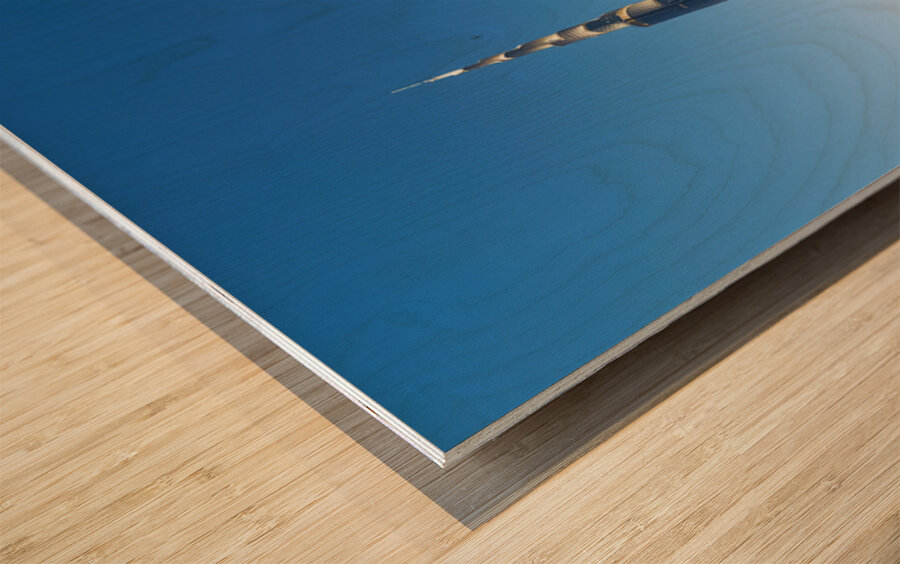 Burj Khalifa and golden horse statue at dusk in Dubai Wood print