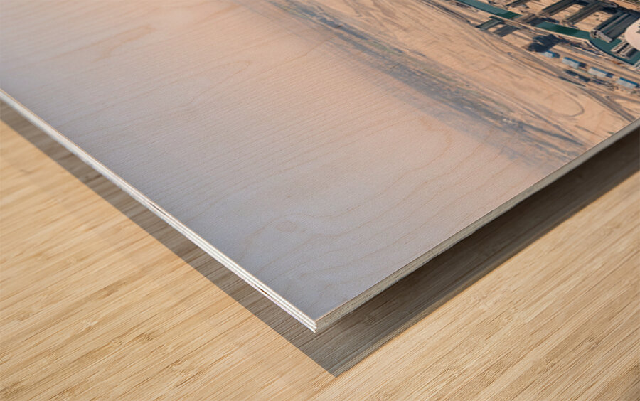 Dubai cityscape shows buildings water and desert from above Wood print