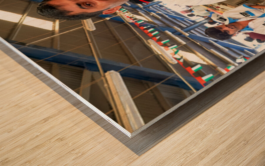 Fishmongers show fresh catch at market in Dubai UAE Wood print