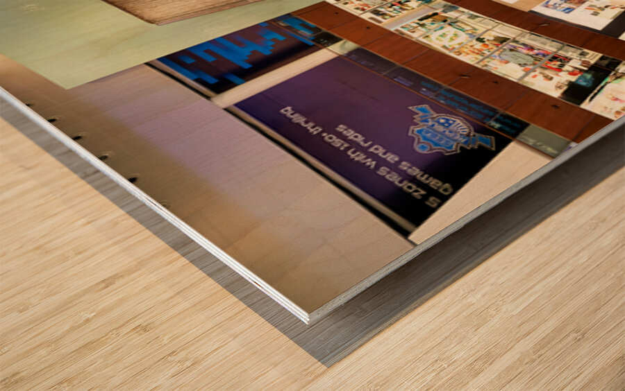 Indoor waterfall with diver sculptures in a mall in Dubai UAE Wood print