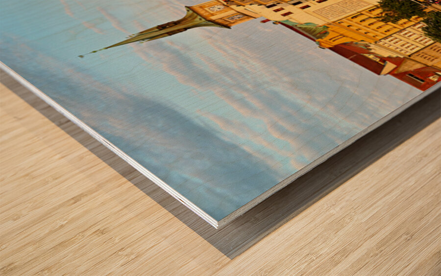 Sunset over Pragues Vltava River historic buildings and boat. Wood print