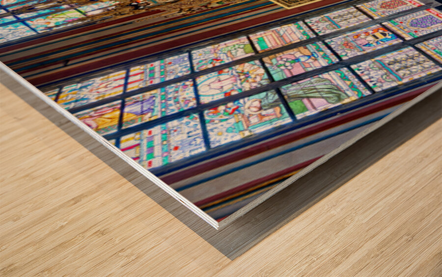 Ornate golden altarpiece and vibrant stained glass windows in a  Wood print