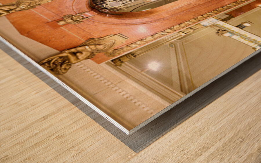 Elegant interior with red carpeted staircase and ornate gold det Wood print