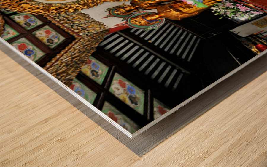 Visitors observe golden statues in Shanghai Buddhist temple inte Wood print