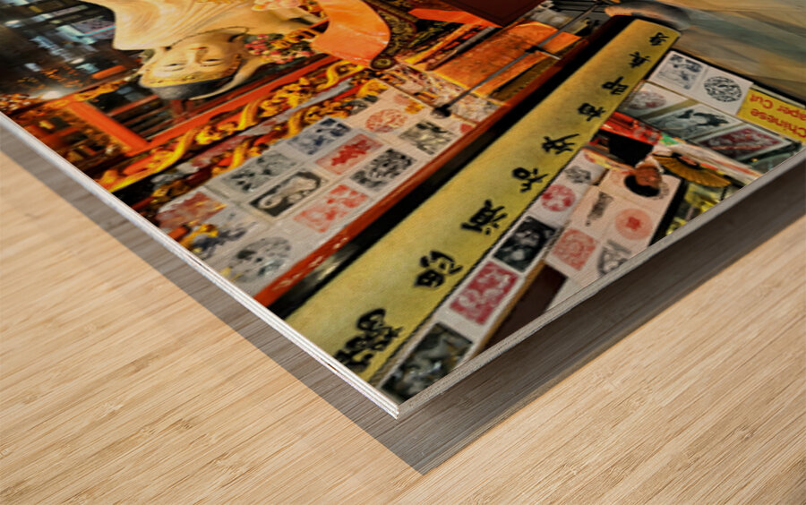 Worshipper kneels before Buddha statue in Shanghai temple Wood print