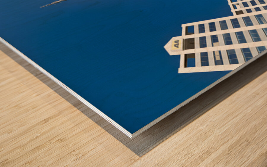 Sky Tower in Auckland showing city buildings and clear sky Wood print