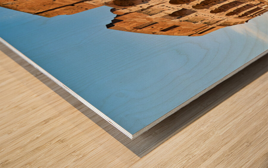 Colosseum stands tall in Rome during golden hour Wood print