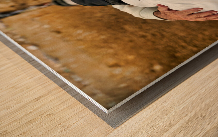 Men embrace each other at the Wailing Wall in Jerusalem Wood print