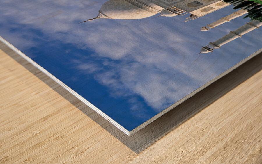 Taj Mahal stands in Agra with clear sky and reflecting pool Wood print