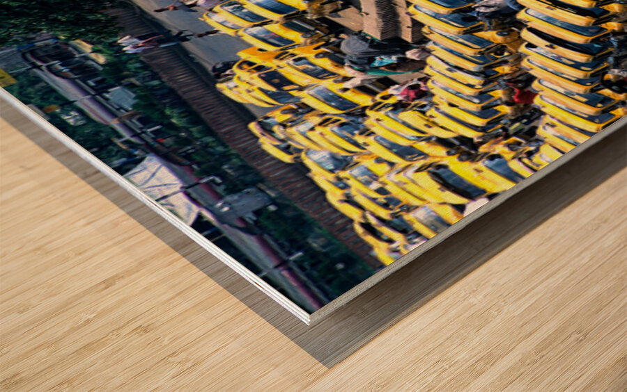 Taxi parking in Kolkatas busy streets during daytime Wood print