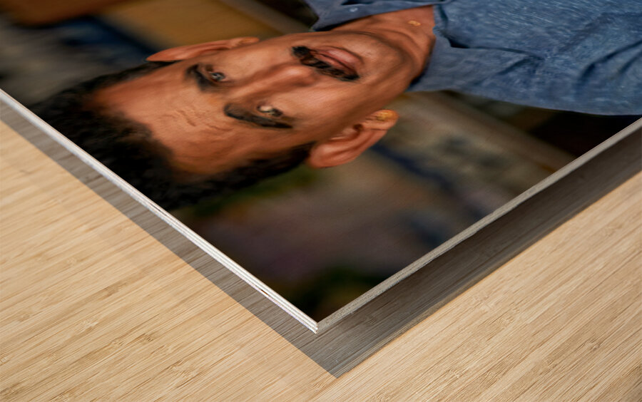 Barber at work in Khimsar Rajasthan India during a busy day Wood print