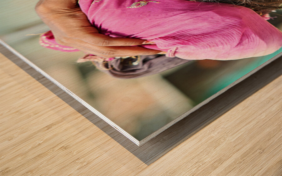 Portrait of a young girl carrying cloth in Mandawa Rajasthan Wood print