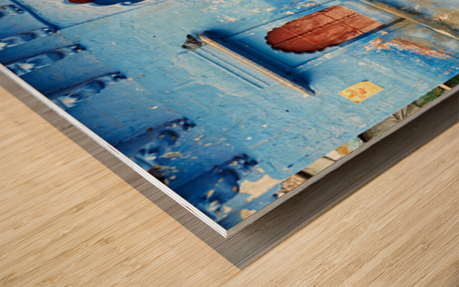 Walking along the blue streets of Jodhpur in Rajasthan India Wood print