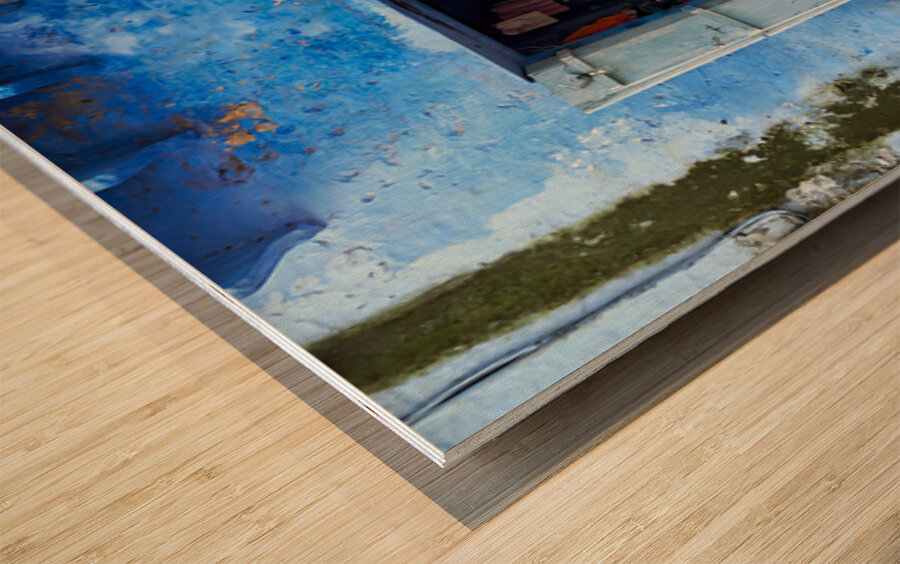 Man sweeps in front of home in Bundi Rajasthan during the day Wood print