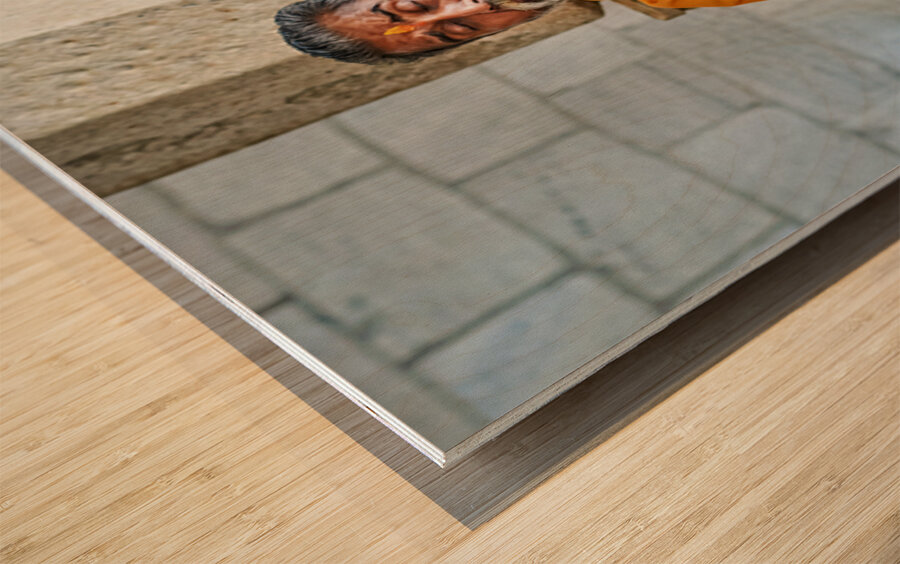 Man prays in Jain temple in Ranakpur Rajasthan during the day Wood print