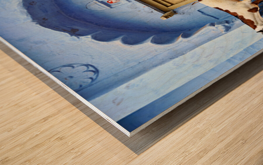 Goat standing on a wall by a wooden door in Bundi Rajasthan Wood print