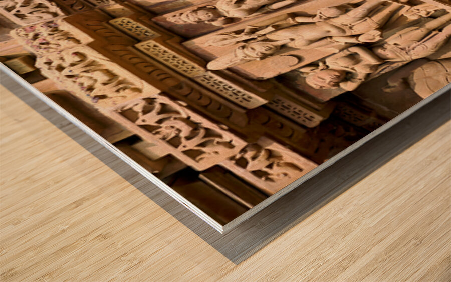 Hindu temples in Khajuraho display intricate erotic carvings Wood print