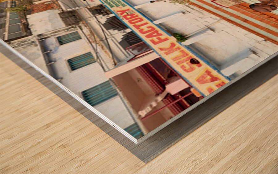 Barechested men offer prayers by the Ganges River in Varanasi Wood print