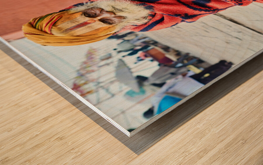 Holy man sadhu sits with offerings in Varanasi Uttar Pradesh Wood print