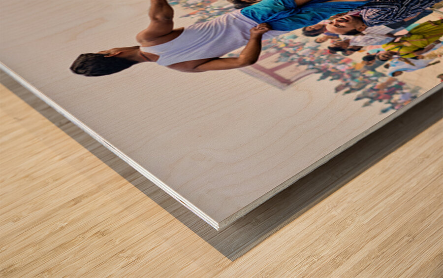 People sit on a boat on the Ganges River Wood print