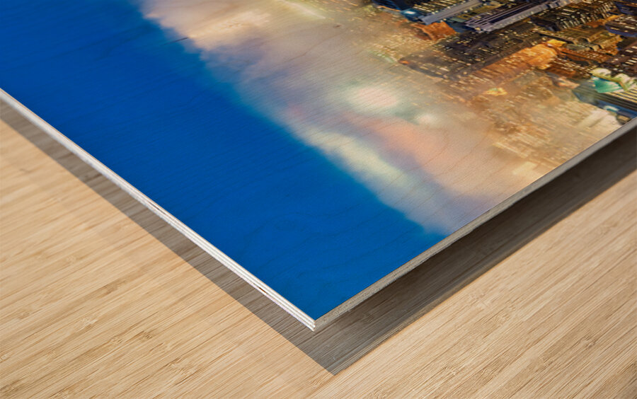 Aerial view shows Manhattan skyline at dusk with city lights Wood print