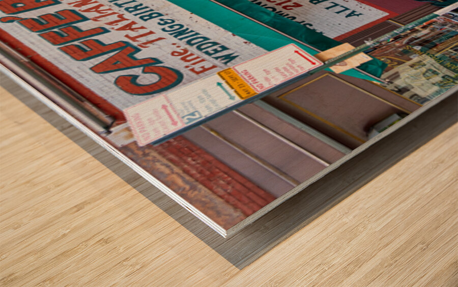 Visitors enjoy pastries at Caffe Roma in Little Italy New York Wood print