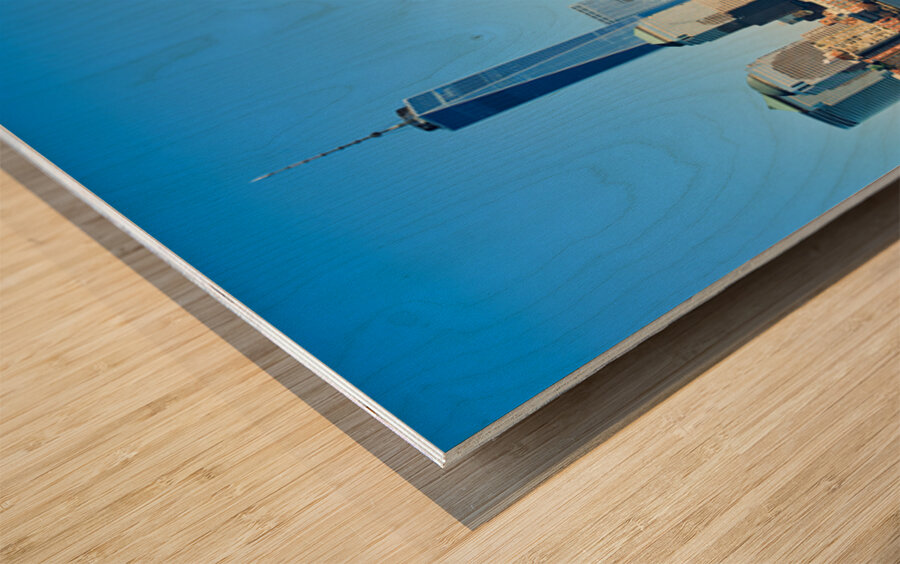 Tourists view Manhattan skyline from a boat on the water in New  Wood print