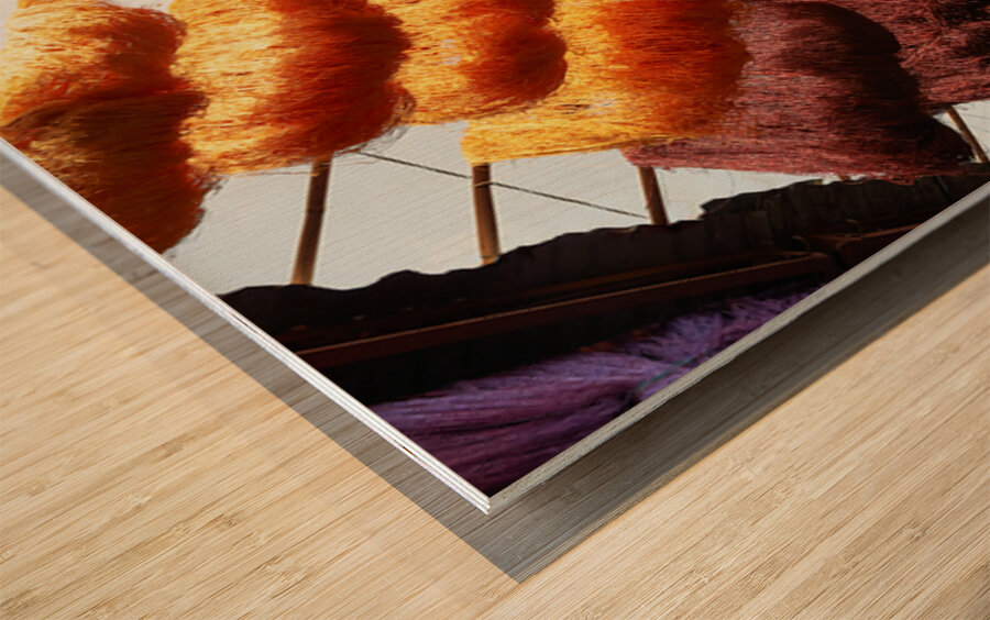 Colorful threads hanging in the dyers souk of Marrakesh Morocco Wood print