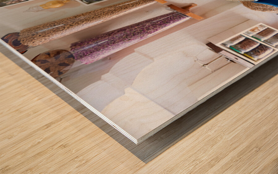 Herbal remedy shop in Marrakesh showing colorful bags of herbs Wood print