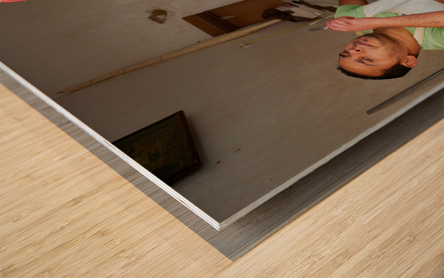 Butcher at work in Meknes souk showing fresh meat and livestock Wood print