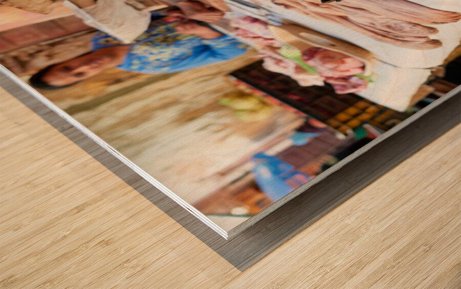 Butcher working in Meknes souk with various cuts of meat Wood print