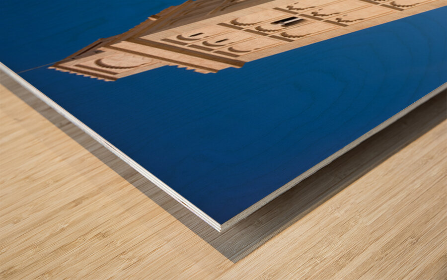 Visit Meknes mosque in Morocco with a tall tower and clear sky Wood print