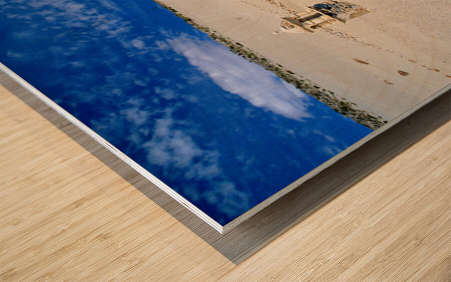 Old church ruins in a desolate sandy landscape. Wood print