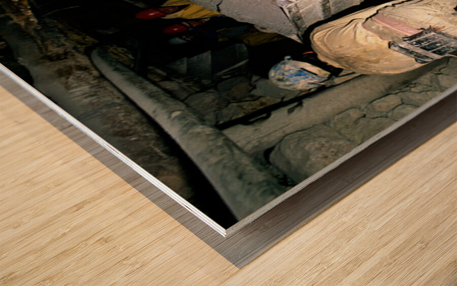 Miners pushing a loaded cart through a muddy underground mine. Wood print