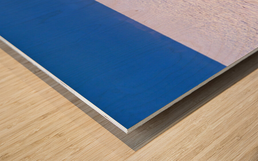 Van driving across vast white salt flat under blue sky. Wood print