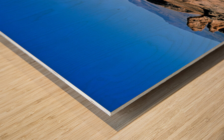 Arid desert with unusual rock pillars against a blue sky. Wood print