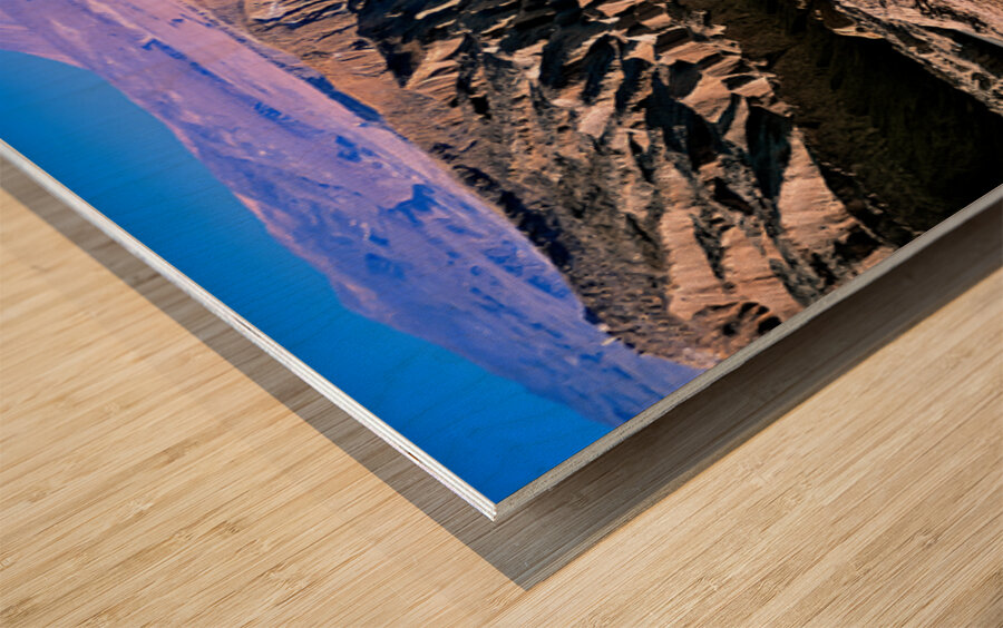 Eroded desert landscape with a road winding through mountains. Wood print