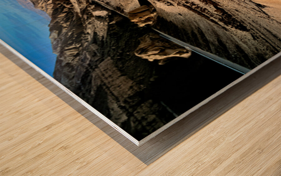 Dramatic arid mountain landscape with a winding road. Wood print